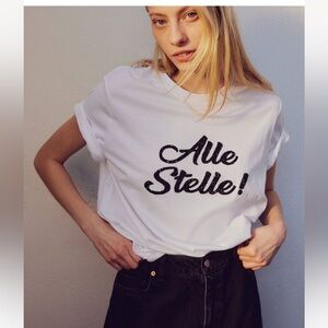 H&M White Short Sleeve Tee with Black Script "Alle Stelle!"